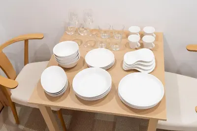a table with white plates and glasses on it at \u6771\u6025\u30b9\u30c6\u30a4\u56db\u8c37 in Tokyo