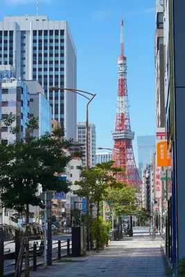 a city street with the eiffel tower in the background at YadoyaTamachi 101 in Tokyo