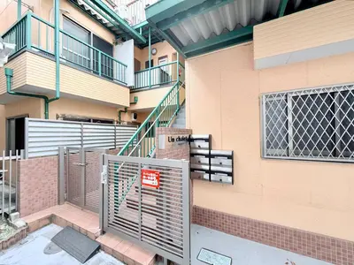 a building with a gate and stairs on it at Tokyo Stay Itabashi #101 in Tokyo