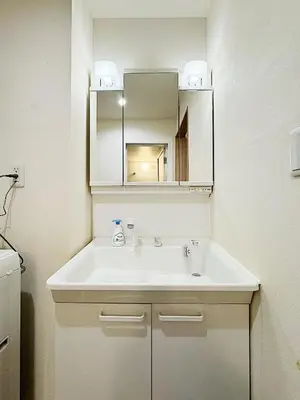 a bathroom with a white sink and a mirror at Tokyo Stay Itabashi #101 in Tokyo