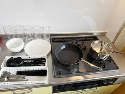 a stove top with pots and pans on it at Tokyo Stay Itabashi #101 in Tokyo