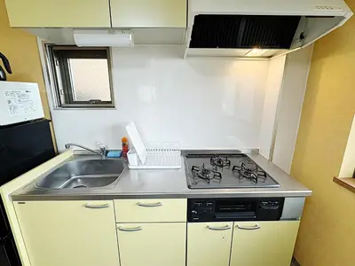 a small kitchen with a sink and a stove at Tokyo Stay Itabashi #101 in Tokyo