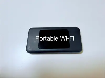 a sign that reads portable wi fi sitting on a table at Tokyo Stay Itabashi #101 in Tokyo