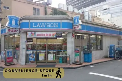 a convenience store on a city street with a person walking in front at \u30a8\u30b3\u30ed\u65b0\u5bbf\u7b2c\u4e8c\u30d3\u30eb in Tokyo