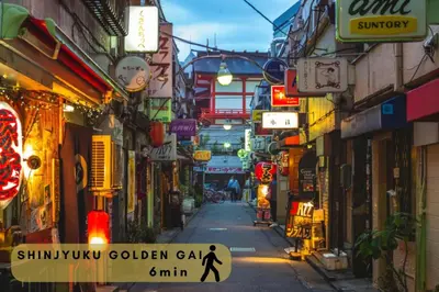 a city street with many shops and signs at \u30a8\u30b3\u30ed\u65b0\u5bbf\u7b2c\u4e8c\u30d3\u30eb in Tokyo