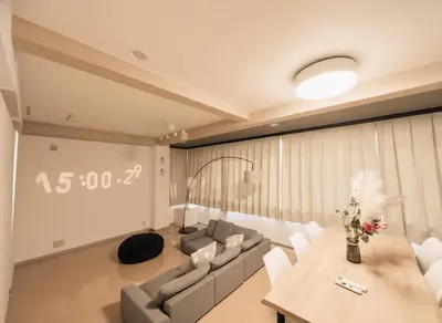 a living room with a couch and a table at \u6771\u4eac\u90fd\u5fc3 \u6751\u4e0a\u7fa9\u7537\u8a2d\u8a08 112\u5e73\u7c73\u9ad8\u7d1a\u8c6a\u90b8 \u5b8c\u5168\u8cb8\u5207 \u6c60\u888b\u96fb\u8eca6\u5206 \u65b0\u5bbf\u6e0b\u8c37\u76f4\u901a \u6620\u753b\u9928 WiFi12\u4eba WAGAMAMA\u5c0f\u7af9\u5411\u539f3\u968e in Tokyo