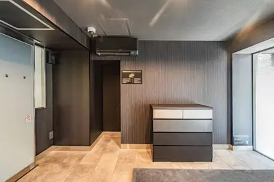 a room with a kitchen with a counter and a ceiling at Apartment Hotel 11 Asakusa 1 in Tokyo