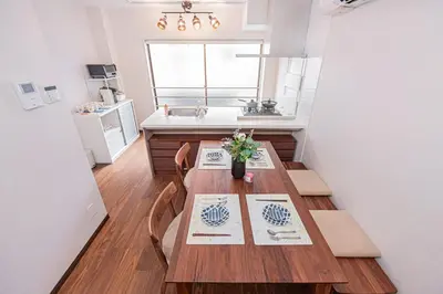 a dining room with a table and a sink at Ueno home 10-minute walk from Ueno Station, 4-minute walk from Inaricho Station, 10-minute walk to Asakusa, 2nd and 3rd floors in Tokyo