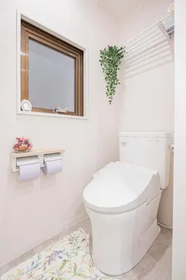 a white bathroom with a toilet and a window at Ueno home 10-minute walk from Ueno Station, 4-minute walk from Inaricho Station, 10-minute walk to Asakusa, 2nd and 3rd floors in Tokyo