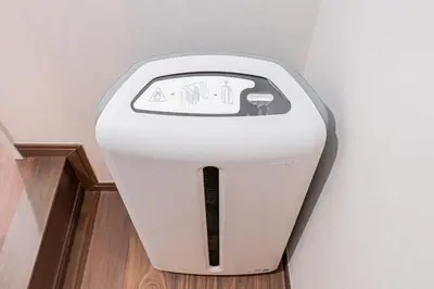 a white toaster is sitting in a room at Ueno home 10-minute walk from Ueno Station, 4-minute walk from Inaricho Station, 10-minute walk to Asakusa, 2nd and 3rd floors in Tokyo