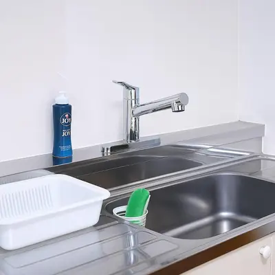 a kitchen sink with a dish drying rack next to it at willcourt in Tokyo