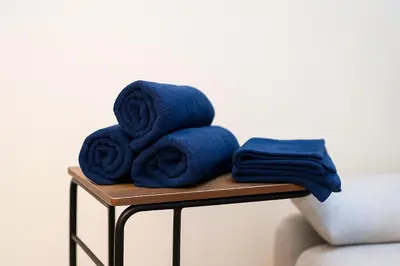 a pile of blue towels sitting on a table at willcourt in Tokyo
