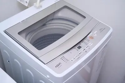 a washing machine with its door open with a microwave at willcourt in Tokyo