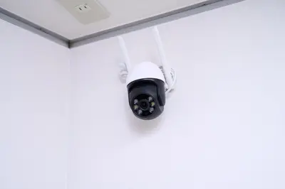 a security camera hanging on a wall at willcourt in Tokyo
