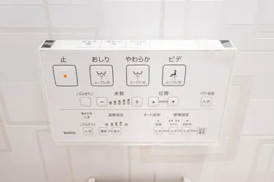 a white microwave with writing on the side of it at Ueno home2 10-minute walk from Ueno Station, 4-minute walk from Inaricho Station, 10-minute walk to Asakusa, 1F in Tokyo