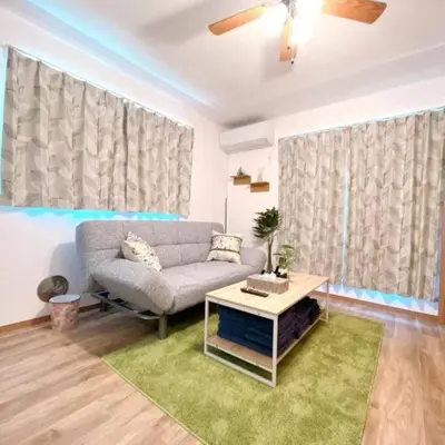 a living room with a couch and a table at \u6771\u7acb\u77f34\u4e01\u76ee-47 in Tokyo
