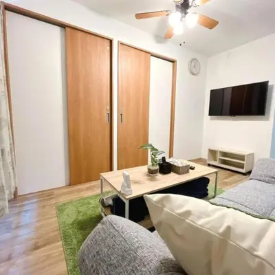 a living room with a couch and a table at \u6771\u7acb\u77f34\u4e01\u76ee-47 in Tokyo