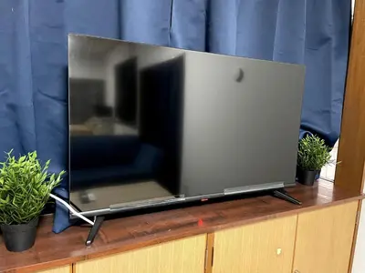 a flat screen tv sitting on top of a dresser at Tokyo Stay sugamo House in Tokyo