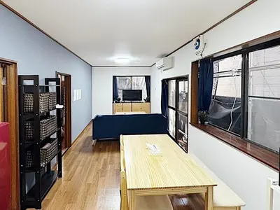 a room with a table and a couch in it at Tokyo Stay sugamo House in Tokyo