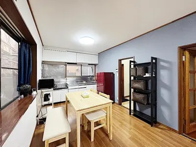 a kitchen with a table and a dining room at Tokyo Stay sugamo House in Tokyo