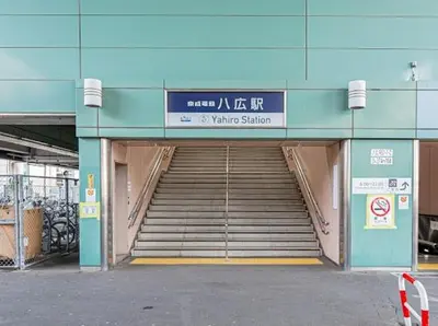a stairway leading to a building with a stairway sign at SkyTreeStayHotel 3, 8-minute walk from Yahiro Station, lovely new building, near Ara river, can see Sky Tree in Tokyo