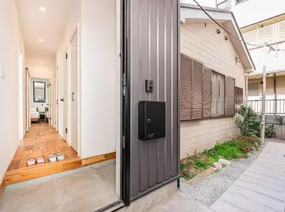 an empty hallway of a house with a door at SkyTreeStayHotel 3, 8-minute walk from Yahiro Station, lovely new building, near Ara river, can see Sky Tree in Tokyo