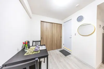 a room with a black table and a mirror at 203 8 min walk to Ikebukuro 6 min walk to Kanamecho Station 25m Max 2 people Direct access to Tokyo, Shinjuku, Shibuya, Ueno in Tokyo