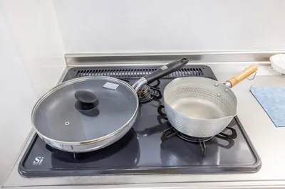a pot and strainer sitting on top of a stove at 203 8 min walk to Ikebukuro 6 min walk to Kanamecho Station 25m Max 2 people Direct access to Tokyo, Shinjuku, Shibuya, Ueno in Tokyo