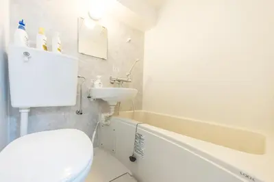 a bathroom with a toilet and a sink and a tub at Ikebukuro 8 min walk, Kanamecho 6 min walk, 25sqm room, 2 guests, Direct access to Shinjuku, Shibuya, Tokyo, Ueno, 1 double bed in Tokyo