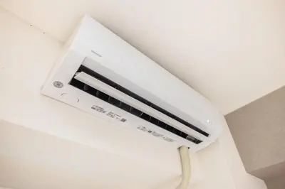 a white air conditioner hanging from a ceiling at Ikebukuro 8 min walk, Kanamecho 6 min walk, 25sqm room, 2 guests, Direct access to Shinjuku, Shibuya, Tokyo, Ueno, 1 double bed in Tokyo