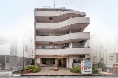 a tall building with balconies on the side of it at Ikebukuro 8 min walk, Kanamecho 6 min walk, 25sqm room, 2 guests, Direct access to Shinjuku, Shibuya, Tokyo, Ueno, 1 double bed in Tokyo