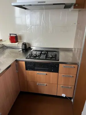 a kitchen with a stove top oven in a kitchen at Sky Tree Stay Hotel, 4-minute walk from Keisei Hikifune Station, detached house with parking, very convenient location in Tokyo