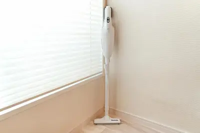 a white vacuum in a corner of a room with a window at Skytree 1 Stop , 5-min Walk , 8 Guests , Fast WiFi in Tokyo