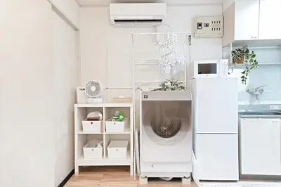 a kitchen with a washing machine in a room at Skytree 1 Stop , 5-min Walk , 8 Guests , Fast WiFi in Tokyo