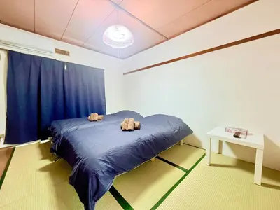 a bedroom with two stuffed animals on a bed at Tokyo Stay \u821e #201 in Tokyo