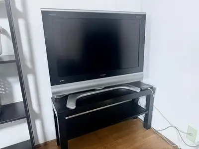 a flat screen tv sitting on a black stand at Tokyo Stay \u821e #201 in Tokyo