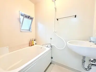 a white bathroom with a tub and a sink at Tokyo Stay \u821e #201 in Tokyo