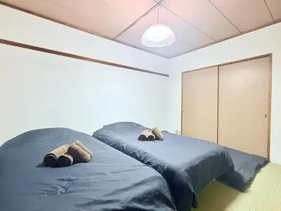 a bedroom with two beds with pillows on them at Tokyo Stay \u821e #201 in Tokyo