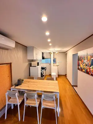 a kitchen and dining room with a table and chairs at K2 A house in Kita-senju in Tokyo