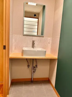 a bathroom with a sink and a mirror at K2 A house in Kita-senju in Tokyo