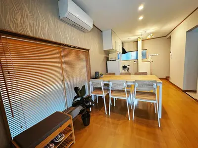 a dining room and kitchen with a table and chairs at K2 A house in Kita-senju in Tokyo