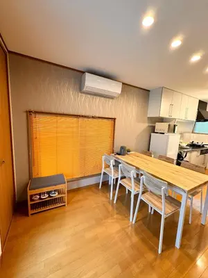 a kitchen with a table and chairs in a room at K2 A house in Kita-senju in Tokyo