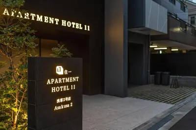 a building with a sign in front of it at Apartment Hotel 11 Asakusa 2 in Tokyo