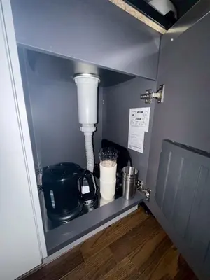 a kitchen shelf with a mixer and a coffee maker at \u30b3\u30fc\u30dd\u5ca1\u5d0e302 in Tokyo