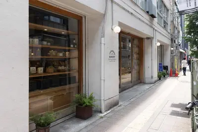 a store window on a city street with a sidewalk at Entire Home in Sangenjaya, 2-stops to Shibuya, and Shinjuku, Lani's Place at Sangenjaya in Tokyo