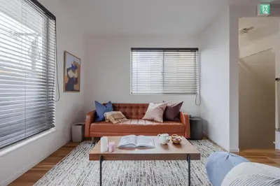 a living room with a couch and a coffee table at Entire Home in Sangenjaya, 2-stops to Shibuya, and Shinjuku, Lani's Place at Sangenjaya in Tokyo