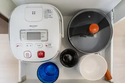 a dryer and other items in a room at 3 minutes to Shinjuku by subway-Nakanokaikan I in Tokyo
