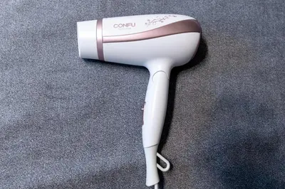 a white hair dryer sitting on the floor at Open Sale Asakusa Skytree Hotel like space 3 minutes from the station in Tokyo