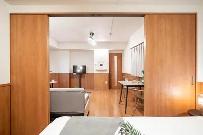 a bedroom with a living room and a dining room at \u30e2\u30f3 \u30b7\u30e3\u30c8\u30fc\u4e2d\u91ce\u54f2\u5b66\u5802 in Tokyo