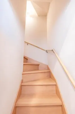 a staircase in a house with wooden floors at \u745e\u6c90 128t in Tokyo